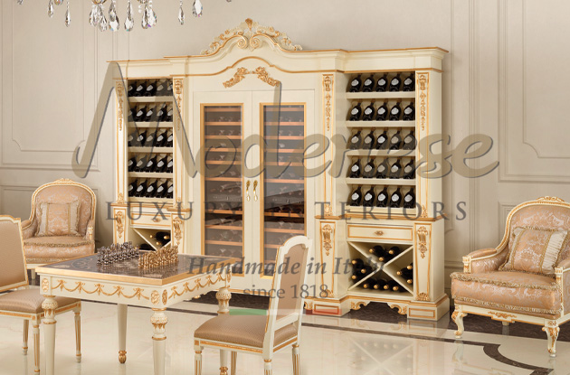 White luxury wine cellar with gold leaf details and Modenese chess board handmade table