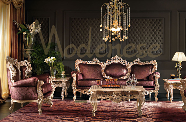 Burgundy red upholstered full gold leaf armchair and sofa with side and coffee tables marble top red carpet chandelier Modenese Luxury Interiors