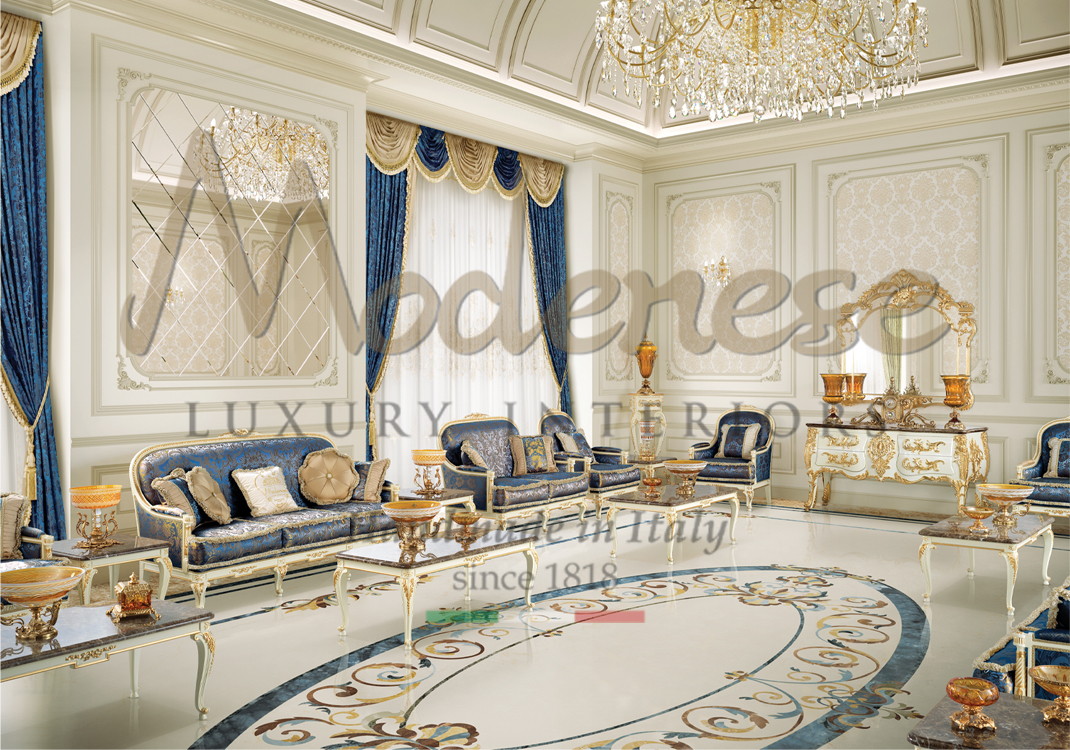 Blue fabric upholstered ivory and gold leaf sofas blue curtains ivory coffee tables with marble top and inlaid marble floor design Modenese interiors