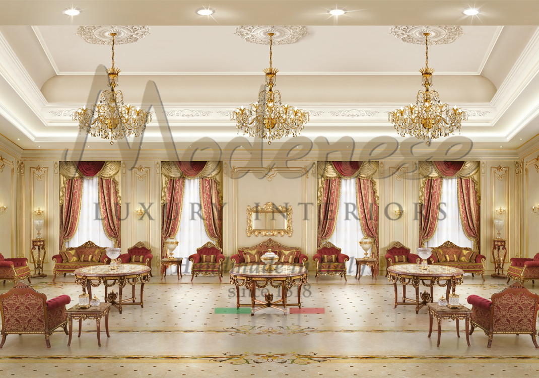 3 chandeliers with Modenese patterned red fabric sofas and armchairs with 3 round tables and red curtains living room