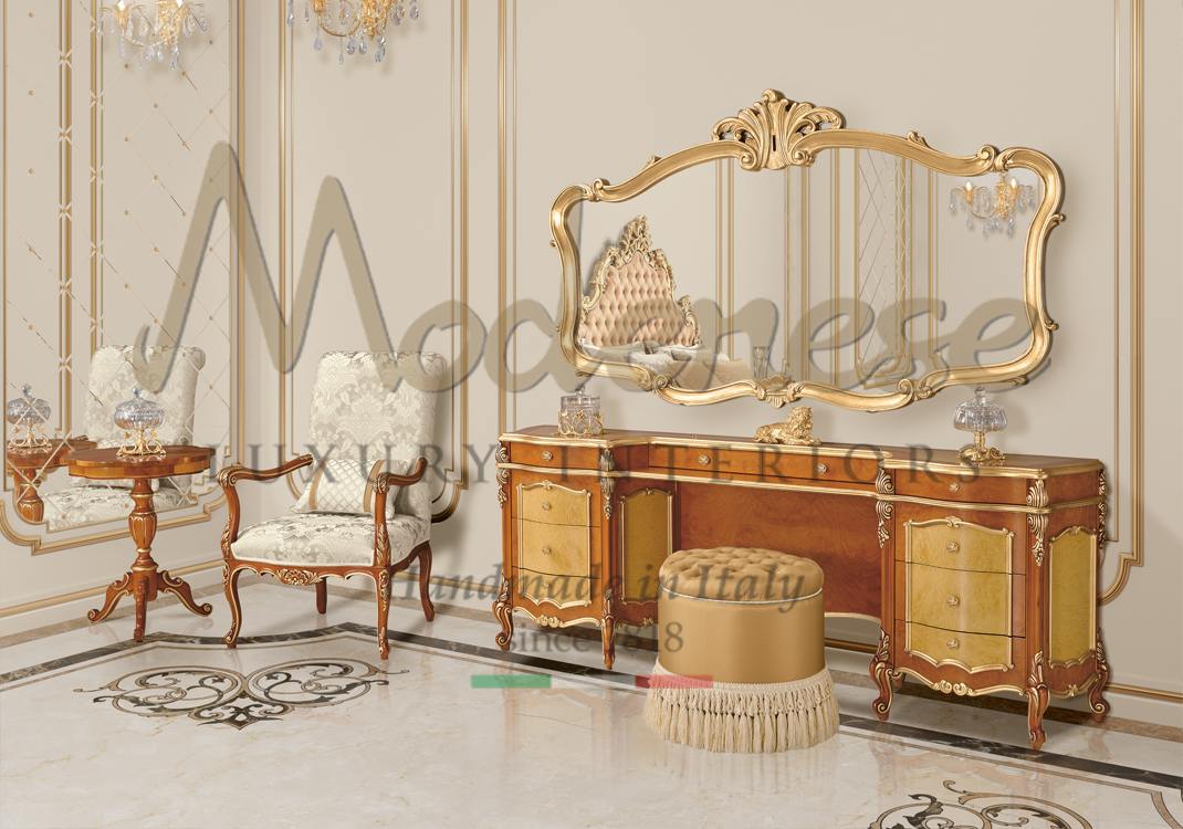 Classic walnut vanity with drawers cream pouf gold leaf mirror and white fabric armchair Modenese interiors