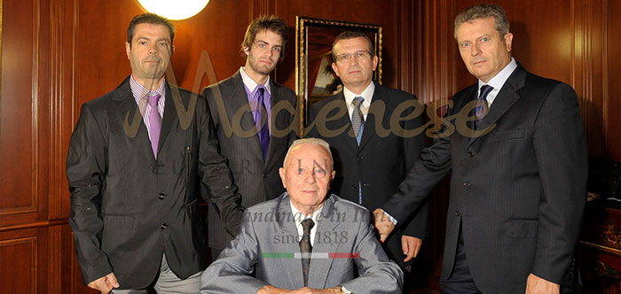 Modenese Gastone sitting and his family sons and nephew behind